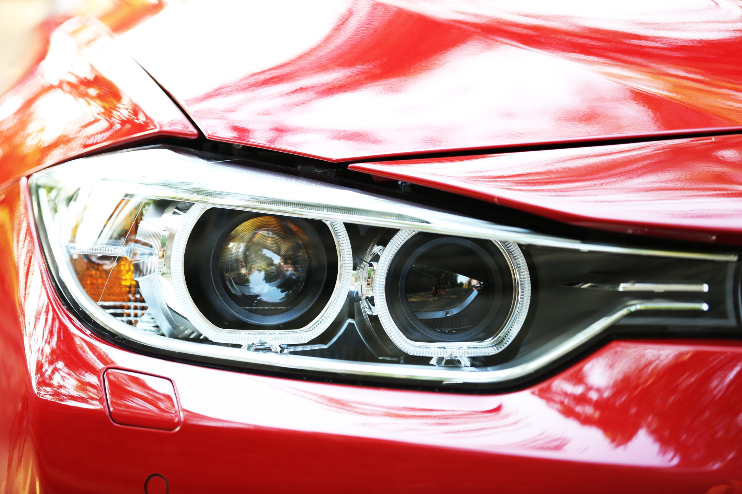 Headlights of red car